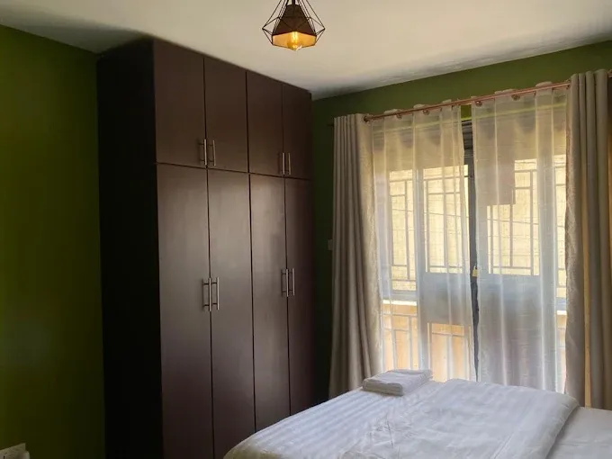 Green bedroom with wardrobe