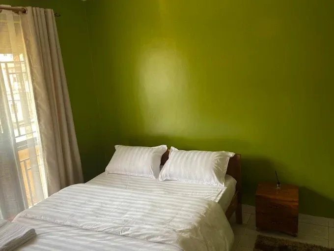 Green bedroom with curtains